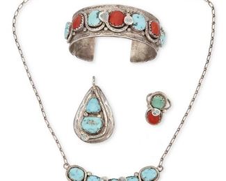 232
Mid/late 20th century
Effie Calavaza (B. 1928, Zuni)
A group of serpent motif silver and set stone jewelry
Each Marked: Effie C. / Zuni
Four works comprising a silver, coral, and turquoise cuff bracelet (6.875" total inner C x 1" H), with a 1.125" gap), a teardrop pendant with set turquoise stones (2.125" H x 1.25" W), a five-stone silver and turquoise necklace with small paper clip chain (20" L x 0.5" H), and a set coral and turquoise ring (Ring size: 7; 1.125" H), 4 pieces
126.2 grams gross
Estimate: $500 - $700