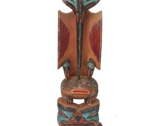 235
Early 20th century; Northwest Coast
A Tlingit Carved Cedar Model Totem Pole
Inscribed in pencil to verso: CLX / 250 / Weather / [illegible] / mosquito / + / tree / toad
The carved wood totem depicting a mosquito, a frog, and a human face colored with turquoise, red, orange, and black pigments
9.25" H x 3.25" W x 2.75" D
Estimate: $800 - $1,200