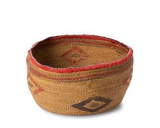 240
Late 19th/early 20th century
A Polychrome Northwest Coast Twined Basket
Twined bowl with polychrome diamond motifs and banding to top, with beaded ribbon to rim
4.5" H x 8.5" Dia. approximately
Estimate: $700 - $900