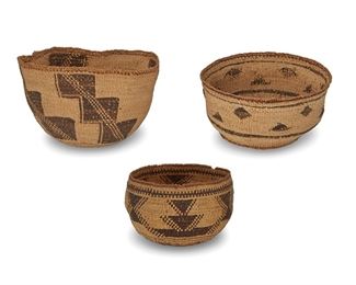 243
Early 20th century
A Group Of Polychrome Northern California Baskets
Comprising a large twined basket with four columns of stepped geometric motifs (5.5" H x 8" Dia.), a medium twined basket with small floating geometric motifs and banding to rim (3.5" H x 7" Dia.), and a small twined basket with alternating columns of stacked triangle shapes and banding to rim (4.125" H x 5.5"-6" Dia. approximately), 3 pieces
Estimate: $400 - $600