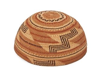 244
Early 20th century; Northern California
A Polychrome Hupa/Yurok/Karuk Basketry Hat
A twined basket hat with polychrome stepped geometric motifs and banded rim
4.25" H x 7" Dia. approximately
Estimate: $500 - $700