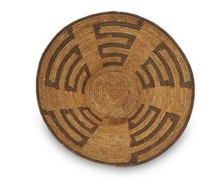 253
Early/mid-20th Century; Tohono O'odham, Arizona
A Large Papago Basket
A coiled bowl with five graduated stepped elements issuing from rim
5.5" H x 16.5" Dia.
Estimate: $300 - $500