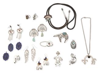 269
Late 20th century
A Group Of Southwest Jewelry
Ten marked for artist/maker; nine further marked: Sterling
Fifteen works comprising an AT sterling silver Rainbow god pendant necklace with set onyx (1.75" H x 2.25" W), an articulated silver pendant of a katsina dancer figure (2.5" H), a sterling silver Kokopelli pendant (2" H), a silver overlay bear claw pendant with set turquoise (1.5" H), a sterling silver abstract Kokopelli pendant/brooch (1.5" H), a large silver overlay heart bear brooch with set turquoise (1.75" H x 2.5" W), a set of Ernest Roy Begay Navajo sterling silver cluster set lapis pendant and matching earrings (Dine; Each: 1.5" H), four pairs of earrings including a pair of R. Monte sterling Sunface and turquoise earrings, a pair of VP abstract Sunface dangle earrings, a pair of EB stone set heart bear silver earrings, a pair of DY incised silver earrings with feather, cloud and lighting motifs (Largest: 2.5" H), as well as two sterling silver rings including an ML kat