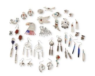 270
Late 20th/21st century
A Large Group Of Southwest Silver Jewelry
Sixteen marked for artist/maker; eighteen further marked for sterling
Twenty-five works comprising ten figurative silver brooches including a Wilfred Begay Navajo Rainbow Yei sterling silver brooch with set turquoise (Dine; 1.25" H x 1.75" W), a R. Monte sterling silver overlay buffalo brooch with set turquoise (1.25" H x 1.75" W), an RD stamped silver thunderbird brooch with central set blue stone (2" H x 1.375" W), a sterling silver eagle head brooch with bead dangles depicting an American flag (2.25" H x 1.625" W), and a Frank Salcido Navajo sterling silver "Comes Charging" figural brooch (Dine; 2" x 2" W), as well as two silver pendants including a Ray Tracey Navajo feather pendant (Dine; 2" H), and a small silver insect pendant with set turquoise body (1" H), together with thirteen pairs of post and dangle earrings including a small pair of FP sterling silver mother of pearl insect earrings, a pair of Zuni-style 