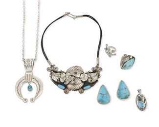 274
Late 20th/21st century
A Group Of Southwest-Style Jewelry
Six works:

A sterling silver and set turquoise squash blossom pendant and associated sterling chain
Each stamped: [unknown conjoined mark] / Sterling
24.5" L x 3.75" H

An Art Tafoya sterling silver and turquoise ring
(b. 20th century, Yaqui)
Stamped: AT [conjoined]
Ring size: 9.5; 1.5" H

A pair of Chris Billie Navajo turquoise slab and sterling silver pierced earrings
(b. 20th century, Dine)
Each stamped: KRS / Sterling
Each: 1.625" H x 1.125" W

A sterling silver and turquoise bear claw pendant
Stamped: SB [conjoined, possibly for Shube's] / © / .925
1.75" H x 0.875" W

A Dominique Dinouart Mexican silver and turquoise crossover ring
Stamped: DDD / 925 / Mexico
Ring size: 9; 1.625" H

A large Mexican silver applied floral leaf cluster plaque necklace accented with turquoise suspended from leather cordage
Stamped: C.I.I. / 925 / Mexico
18" L x 2.5" H

8 pieces
203.1 grams gross
Estimate: $300 - $500
