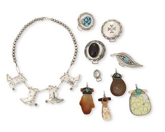 276
Late 20th/21st century
A Group Of Contemporary Southwest Items
One marked for artist; further stamped: Sterling
Comprising a JNY sterling silver cowboy boot necklace with silver beads (18" L x 1.5" H), a group of five silver badge holder pins in various styles and sizes including two with central set turquoise and one with central set onyx (Largest: 1" H x 3" W; smallest: 0.75" Dia.), and a group of contemporary fetish-style stone and ceramic pendants in various styles and designs, all with wire loops, beads, set stones and leather bindings (Largest: 2" H x 1.5" W, smallest: 1.75" H x 1" W), 10 pieces
Weighable silver: 96.5 grams gross
Estimate: $300 - $500