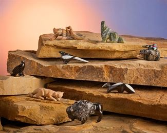 277
Late 20th/21st century
A Group Of Zuni Stone Fetish Animals
Each variously marked
Comprised of two bound Picasso marble bears (Ed Lementino), a serpentine coyote (Jose Espino), a black marble raven, a black marble and mother-of-pearl skunk, and a black marble and mother-of-pearl mockingbird (each Calvert Bowannie), a Picasso marble mountain lion (Liebert Kaskalla), a Picasso marble lizard (Anthony Mecale), and an etched black marble buffalo (Curtis Garcia), 8 pieces
Lizard: 1" H x 3" L
Estimate: $200 - $300
