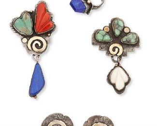 288
Late 20th century
Jolene Eustace (B. 20th Century, Zuni/Cochiti Pueblo)
A group of sterling silver and gold Pueblo jewelry
Each stamped: JAE / Sterling; three further marked: 14K; one further marked: 18K
Four works comprising a textured silver and 14k yellow gold pendant with set turquoise, coral and lapis stones (3.5" H x 1.625" W), a textured silver and 18k yellow gold pendant/brooch with set turquoise and mother-of-pearl (2.75" H x 1.75" W), a textured sterling silver and 14k gold ring with pyramidal set lapis lazuli stone (Ring size: 7.25) and a pair of silver disc pierced earrings with applied 14k yellow gold spiral motif (Each: 1.125" Dia.), 5 pieces
79.4 grams gross
Estimate: $400 - $600