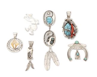 289
Mid/late 20th century
A Large Group Of Southwest Pendants
Six works:

Delbert Vandever
(b. 20th century, Dine)
Two Navajo shadowbox sterling silver pendants with incised motifs and set turquoise stones, one with feather dangles
Each stamped: Delbert Vandever / Sterling
Larger: 6" H x 1.5" W; smaller: 2.25" H x 1.5" W
2 pieces

A large sterling silver foliate overlay pendant with set turquoise and coral branch
Stamped: JR / Sterling
4" H x 2" W

A sterling silver overlay ring pendant with bear foot motifs and feather dangles
Stamped: DY / Sterling
4" H x 0.5" W

A large stamped sterling silver disc pendant with gold overlay bear motif
Stamped: RJ [possibly Robert Johnson, Navajo/Dine] / Sterling / 1/20 / 12K G.F.
2.5" H x 2" Dia.

A naja-style silver pendant with stamped motifs and set turquoise cabochons
Appears unmarked
2.5" H x 2.5" W

An incised sterling silver katsina dancer figural pendant
Stamped: Sterling
3" H x 2" W

7 pieces total
202.1 grams gross
Estimate: $300 - $500