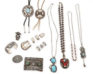 292
Mid/late 20th century
A Large Group Of Southwest-Style Jewelry
Fourteen works:

Rosco Scott
(b. 20th century, Dine)
A Navajo silver overlay cuff bracelet
Stamped: Rosco Scott
6.75" total inner C x 1" H, with a 0.875" gap

Lee Weebothee and Mary Weebothee
(1927-2015 and b. 20th century, Zuni)
A Zuni silver overlay pendant with two set turquoise stones on an associated chain
Stamped: Lee/Mary / Zuni
4.75" H x 21" L

A four-piece Silver Star chased sterling silver ranger set
Buckle stamped: Silver Star; each further stamped: Mexico / Sterling SIlver / 925
Buckle: 1.75" H x 1.875" W; each keeper: 0.875" H; tip: 0.75" H x 1.125" W
4 pieces

Two silver bolos
First bolo etched: Sterling / [illegible: EB or PB]; second appears unmarked
Comprising an oval bolo with set shell and silver overlay with Bighorn sheep motif on a beige leather cord with antler tips, and a modernist-style bolo with central set turquoise on a black leather cord with silver tips
First: 2.625" H x 2.25" W; second: 3" 
