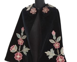 293
Late 19th/early 20th century; Lakota/Minneconjou Sioux
A Lakota Sioux Velvet Opera Cape
Attributed to Edith Claymore (1858-1910), the velvet cape with detailed beaded floral and butterfly designs around the body, with floral vining around the collar, and lined in a black floral brocade, with hook closure at neck
22.5" H at center front; 24.5" H at center back; 95" total hem circumference
Estimate: $2,000 - $3,000