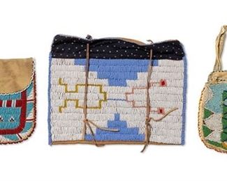 298
Late 20th century
A Group Of Native American Beaded Hide Bags
Comprising three beaded bags, including a small bag with a handle and geometric designs in greens, blues and white with beaded edging and a lining (6.5" H x 5.75" W), a small flat pocket bag in red, white and blue geometric designs with a hide flap (6.375" H x 6" W), and a larger rectangular beaded hide bag with blue and white beaded front, lined with star patterned cotton, and fastened with skunk beads and leather ties (8.5" H x 10.5" W), 3 pieces
Estimate: $200 - $400