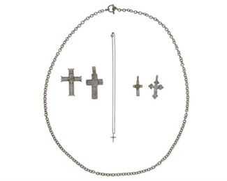 306
Late 20th/early 21st century; New Mexico
A Group Of Silver Jewelry
Comprising three Lawrence Baca cast silver cross pendants (each stamped: LB / Sterling; sacred heart cross further stamped: 18K; largest: 2.75" H), a Juan Lopez stamped and overlay sacred heart cross pendant (stamped: JL [conjoined]; 2.375" H), a Michelle Tapia small sacred heart cross pendant necklace (cross stamped: Tapia; detachable chain stamped: Italy / 925 / Diagonal; 18" L x 0.75" H), and a long chunky silver chain with toggle closure (toggle ring stamped: Mex / 925 [partial]; 41" L), 7 pieces
130.9 grams
Estimate: $200 - $300