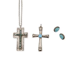 308
Mid-20th Century and later
A Group Of Southwest Silver And Turquoise Jewelry
Three works:

Pearl Ukestine
(b. 20th Century, Zuni)
A Zuni stamped silver and row set turquoise cross pendant on a square link chain
Cross stamped: JP [conjoined] / Ukestine / Sterling / Zuni; Chain clasp stamped: AGI / 925 / Italy
Cross: 2.625" H x 1.625" W; Chain: 30" L

A cast silver and set turquoise cross pendant
Stamped: Sterling
3" H x 1.75" W

A pair of turquoise set pierced earrings
Each appears unmarked
Each 0.75" H

5 pieces
52.0 grams gross
Estimate: $200 - $400