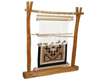 313
Late 20th century; Dine
A Loom With A Navajo Two Grey Hills Weaving Sample
Comprised of a loom formed from two natural wood branches, with a Two Grey Hills weaving sample attached
21.75" H x 20" W x 4.5" D
Estimate: $100 - $200