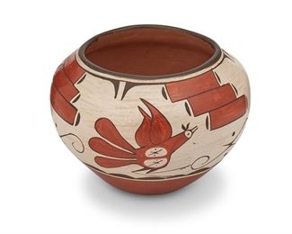 325
Reyes Pino (B. 1950, Zia Pueblo)
Pottery bowl
Signed to underside: Reyes Pino / Zia
The polychrome pottery vessel with birds and stepped motifs on a buff ground
5.75" H x 8.25" Dia.
Estimate: $200 - $300