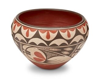 327
Sofia Medina (1932-2010, Zia Pueblo)
A polychrome pottery bowl, circa 1950s
Signed to the side: Sofia Medina
The large vessel with polychrome avian motifs and a red foot
6.75" H x 10" Dia.
Estimate: $200 - $400