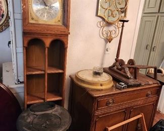 Clock cabinet and cast iron black stove
