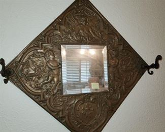 Cherub pressed copper mirror