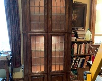 Lighted lead glass cabinet.
