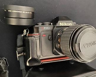 $50. Nikon N2000 includes lens WC-DC52, sigma UC zoom 