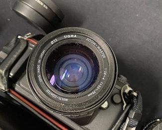 $50. Nikon N2000 includes lens WC-DC52, sigma UC zoom 