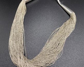 $75. Sterling Necklace "Liquid Silver" 100 strands. 69.3 grams 