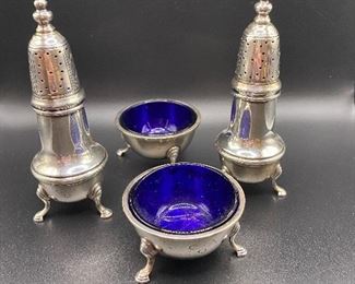 $700. Cartier Sterling Tall Footed Salt & Pepper Shakers and Blue Glass Salt Cellars. Monogrammed C A O. 