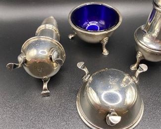 $700. Cartier Sterling Tall Footed Salt & Pepper Shakers and Blue Glass Salt Cellars. Monogrammed C A O. 