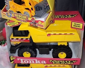 Tonka toy trucks, new in boxes. Mighty dump. Rescue heroes