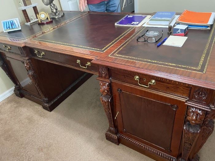 Desk plus Credenza: This set was purchased from an Art Gallery in San Francisco. It is a replica not an original. Owned by current owners since 1997. Estimated to have been made in the 1950’s.The desk is double sided with drawers and shelf space on both sides and most of the wood is believed to be cherry with leather top. Desk measures 6’.9”x3’.5”credenza measures 6’x6”x 1’.8” The set will be sold together. Asking price is $6,000