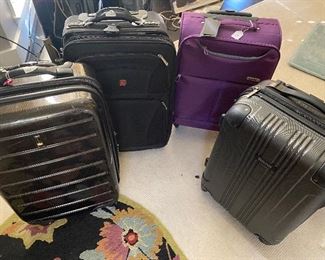 Lot#138 - $110 - Assorted lot of 4 suitcases approx. 22"x14" each