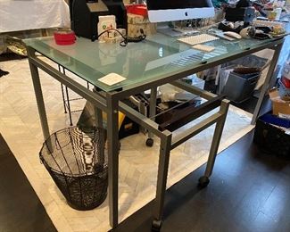Lot#165 - $295 Contemporary desk. Frosted glass on metal base with separate hanging file holder file 5’ x 30”x 30-1/2”h