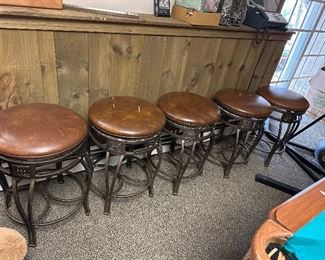 Five. Swivel barstools some need recovering.