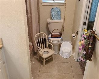 Vintage potty chair with porcelain chamber
