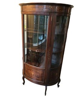 $700 USD      Mahogany Demilune Inlaid Panels Curved Glass Curio Cabinet c1900 KL168-8       Description: One door.  Heavy inlay.  Gorgeous piece that can be used for a stunning bookcase.  A true showstopper!
Dimensions: 36w x 20d x 64"H
Condition: Very good vintage condition.
Local pick up Vienna, VA.   Located on first floor.  Contact us for shipper suggestions.      https://goodbyhello.com/products/mahogany-demilune-inlaid-panels-curved-glass-curio-cabinet-c1900-kl168-8?_pos=12&_sid=63456a554&_ss=r