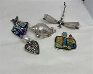 Lot 122 3 Bid(s)
5 .925 SIlver pendants/Brooches Gross Weights 78g