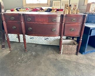 Antique mahogany federal style sideboard with reeded legs. 
