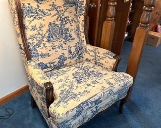 Blue & white toile upholstered wingback chair (pair available)