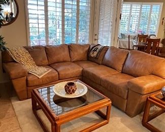 Beautiful leather sofa & wooden coffee table with glass top