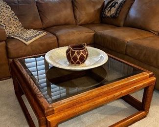 wooden coffee table with glass top