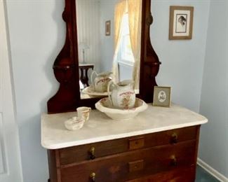 Beautiful Victorian marble top dresser with mirror and ball-drop drawer pulls.