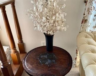 Very cool carved wood accent table.