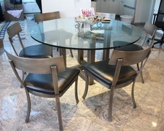 Kitchen glass top table with 6 “Design Institute of America” brushed steel Klismos style chairs