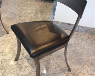 Kitchen glass top table with 6 “Design Institute of America” brushed steel Klismos style chairs