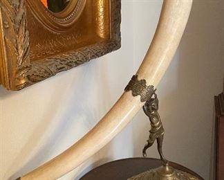 $100 Faux Horn on brass figure stand 26x21