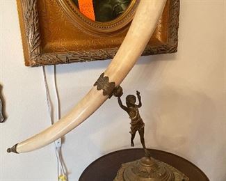 $100 Faux Horn on brass figure stand 26x21