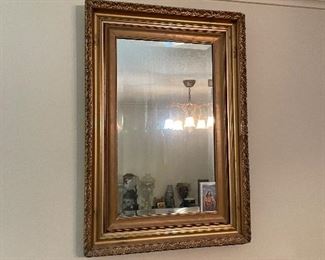 $60 Gilded platser mirror above tall chest 