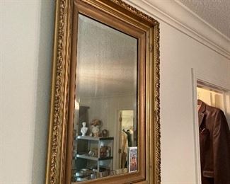 $60 Gilded plaster mirror above tall chest 