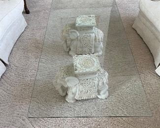 32 - $295 	Glass bevel top Elephant cream table 17Tx5'Wx30W		

